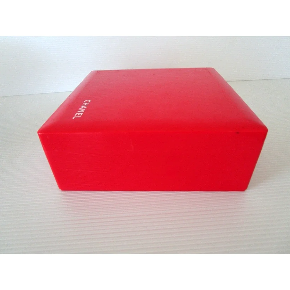 CHANEL red plastic